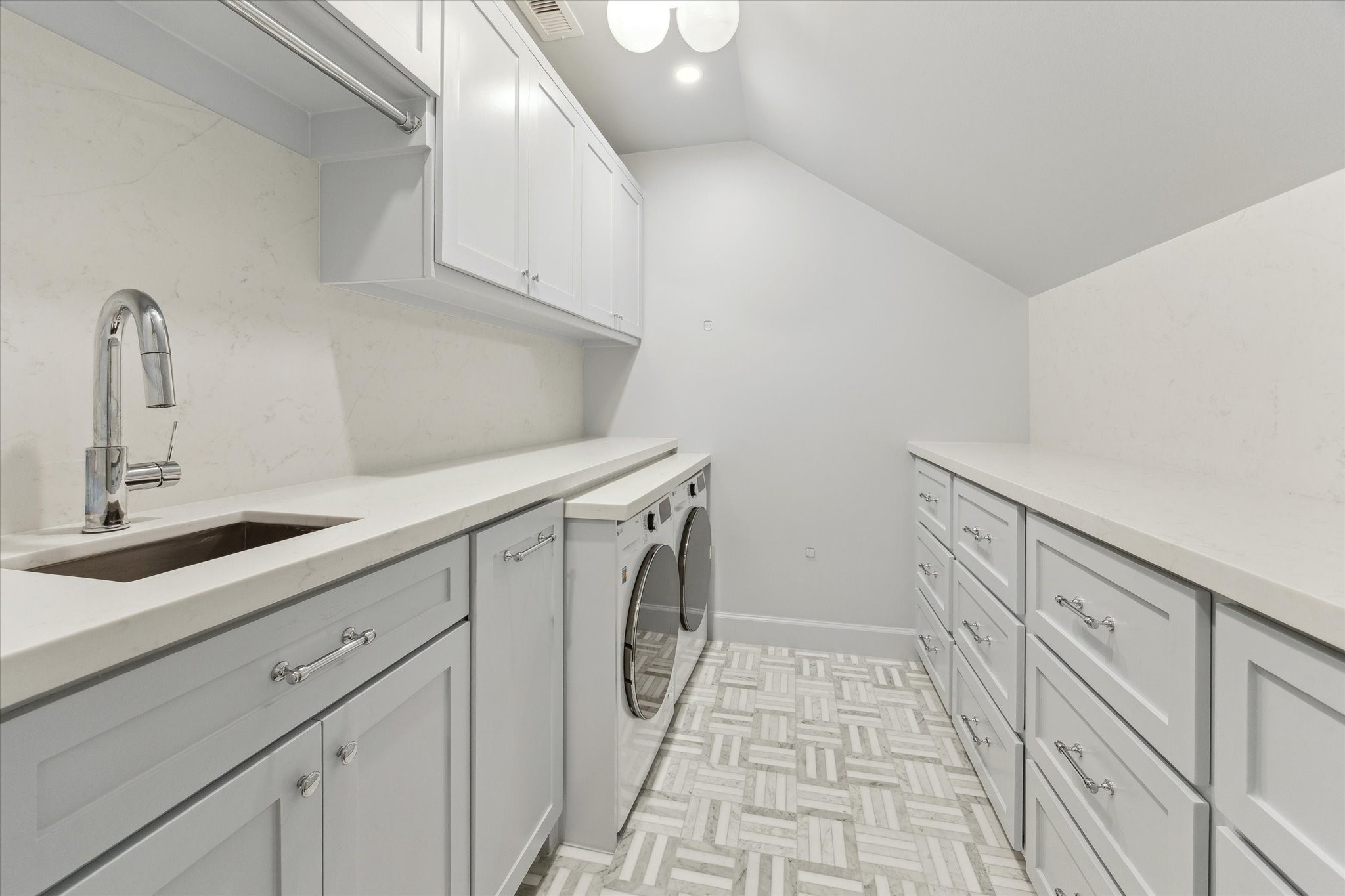2124 Sul Ross Street Houston, TX 77098 - Photo 25 of 36 Second floor utility room with sink, storage and counter space adorned by Farrow and Ball paint.
