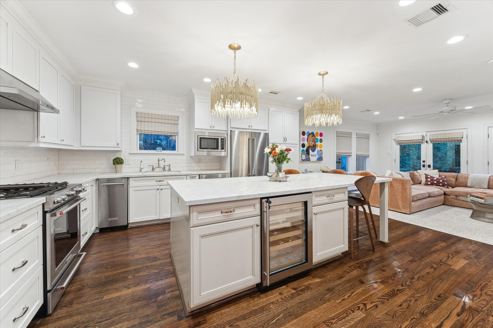 2124 Sul Ross Street Houston, TX 77098 - Photo 9 of 36 Fabulous island kitchen with beverage fridge, bar seating, and stainless appliances.