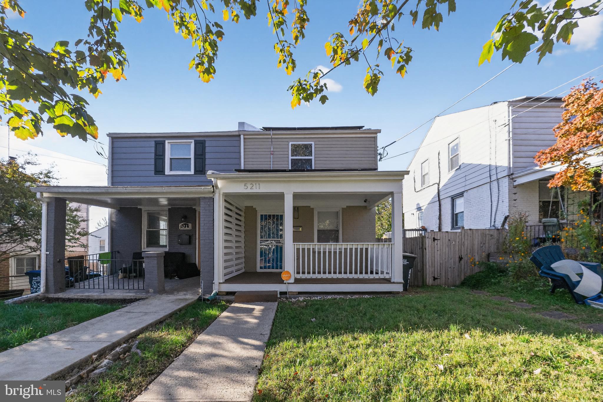 5211 Jay Street Northeast Washington, DC 20019 - Photo 17 of 17 a view of a brick house with a yard and plants