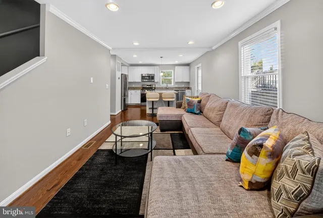 a living room with furniture and a rug
