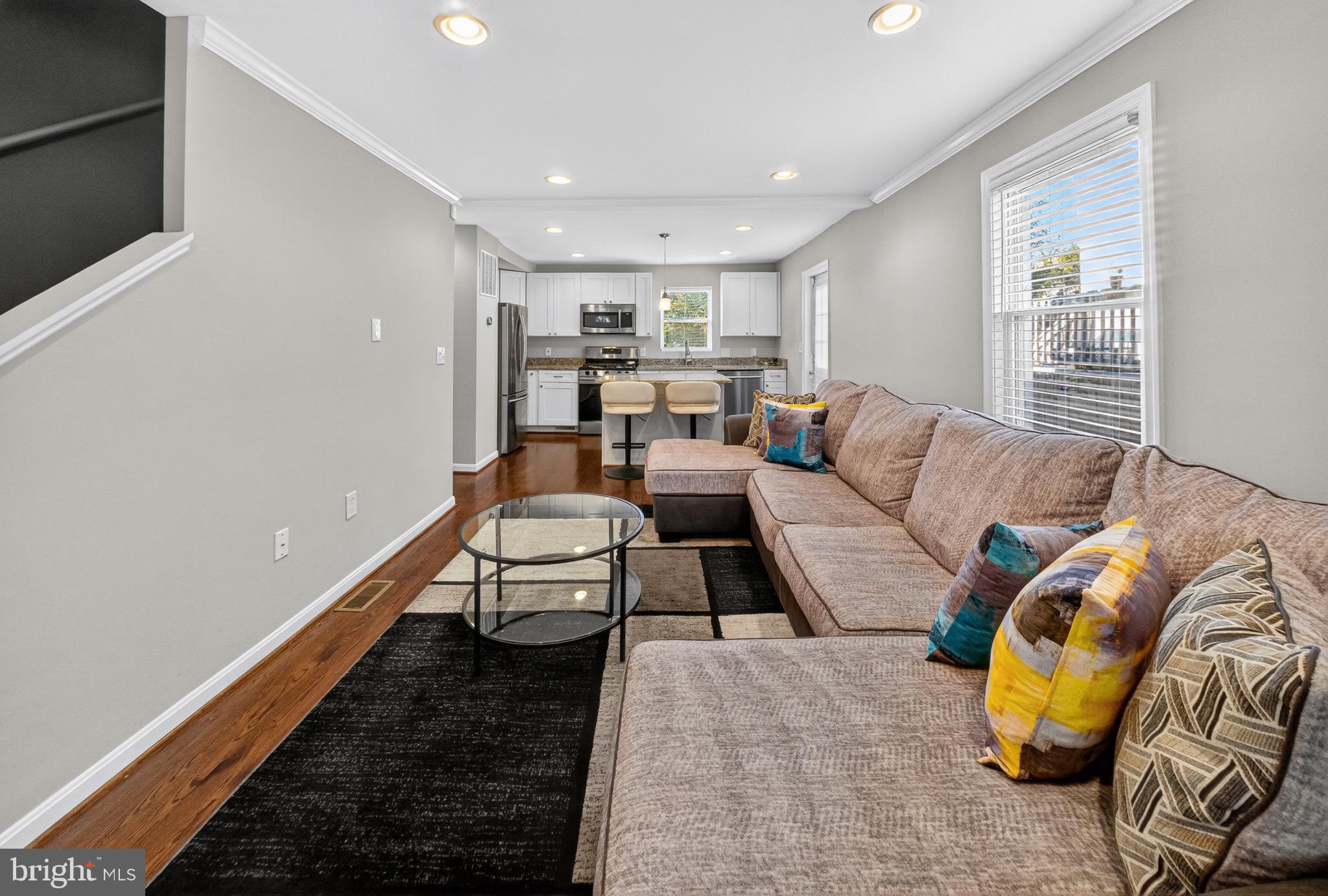 5211 Jay Street Northeast Washington, DC 20019 - Photo 2 of 17 a living room with furniture and a rug