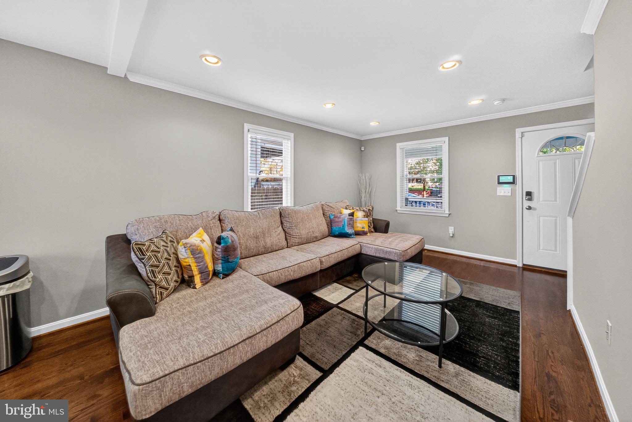 5211 Jay Street Northeast Washington, DC 20019 - Photo 4 of 17 a living room with furniture and wooden floor