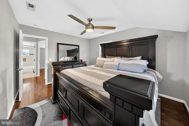 a bedroom with a bed and a television