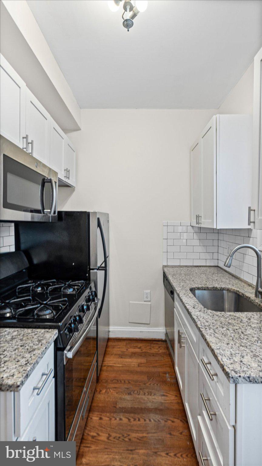 847 Carroll Street Baltimore, MD 21230 - Photo 8 of 33 Modern kitchen with sleek finishes.