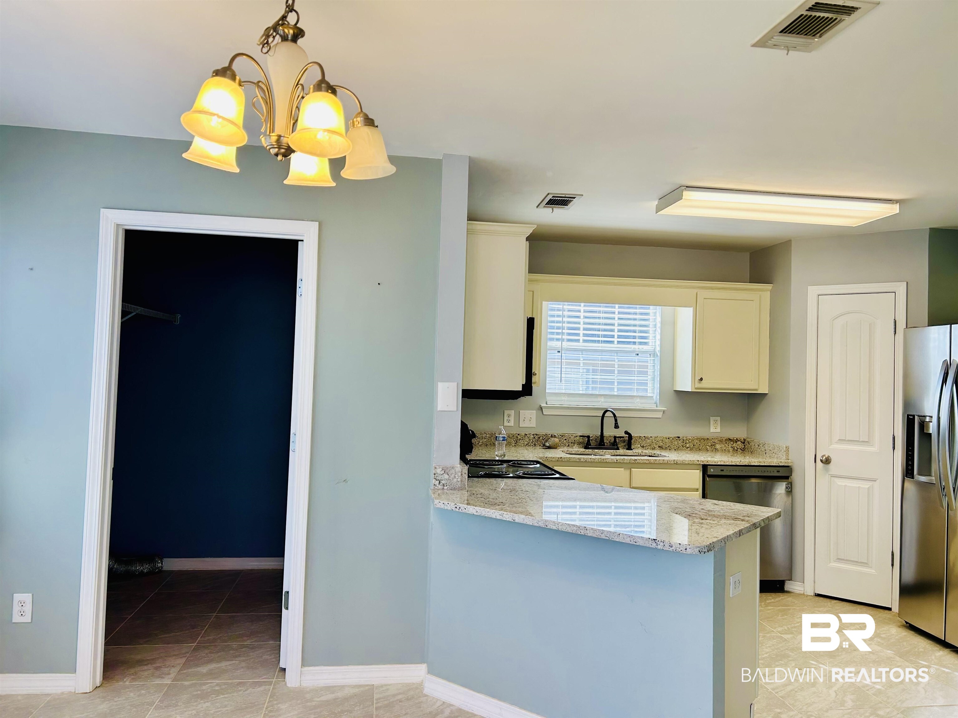 919 Parliament Court Mobile, AL 36695 - Photo 2 of 19 Kitchen featuring sink, stainless steel fridge, dishwasher, kitchen peninsula, and pendant lighting