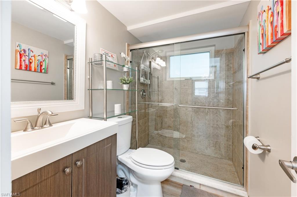 532 4th Avenue South, Unit 2 Naples, FL 34102 - Photo 11 of 19 a bathroom with a sink toilet and shower