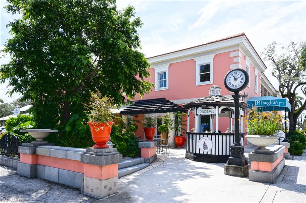 532 4th Avenue South, Unit 2 Naples, FL 34102 - Photo 16 of 19 a front view of a house with garden
