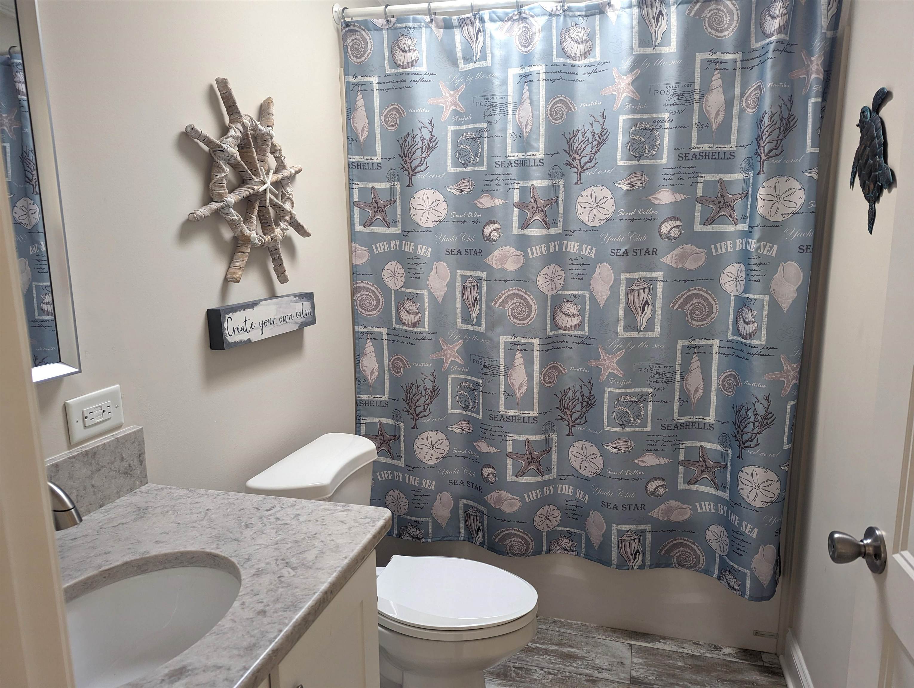 2058 S Shore Ocean View, NJ 08246 - Photo 14 of 27 a bathroom with a granite countertop sink a toilet and shower