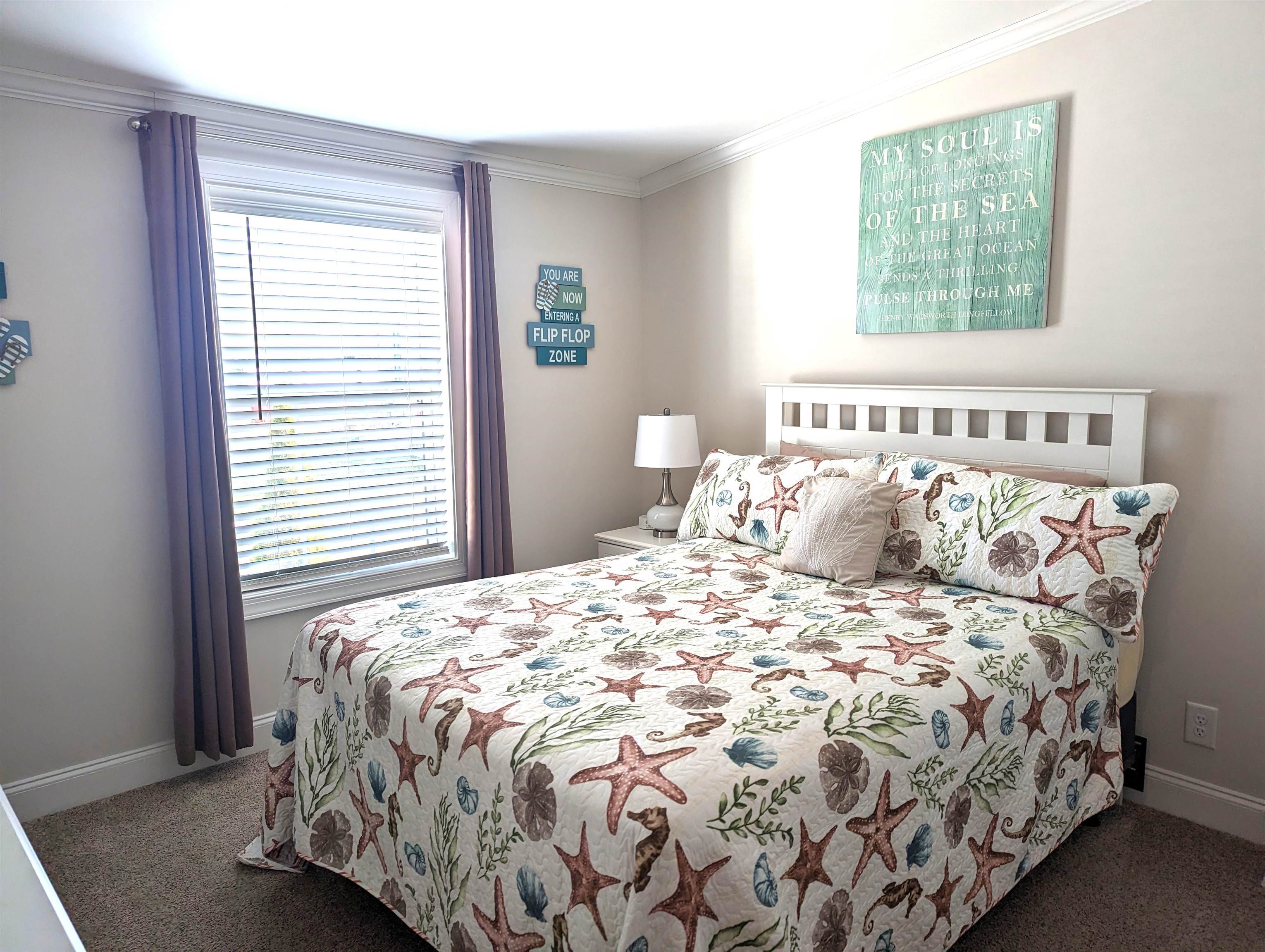 2058 S Shore Ocean View, NJ 08246 - Photo 15 of 27 a large bed sitting in a bedroom next to a window