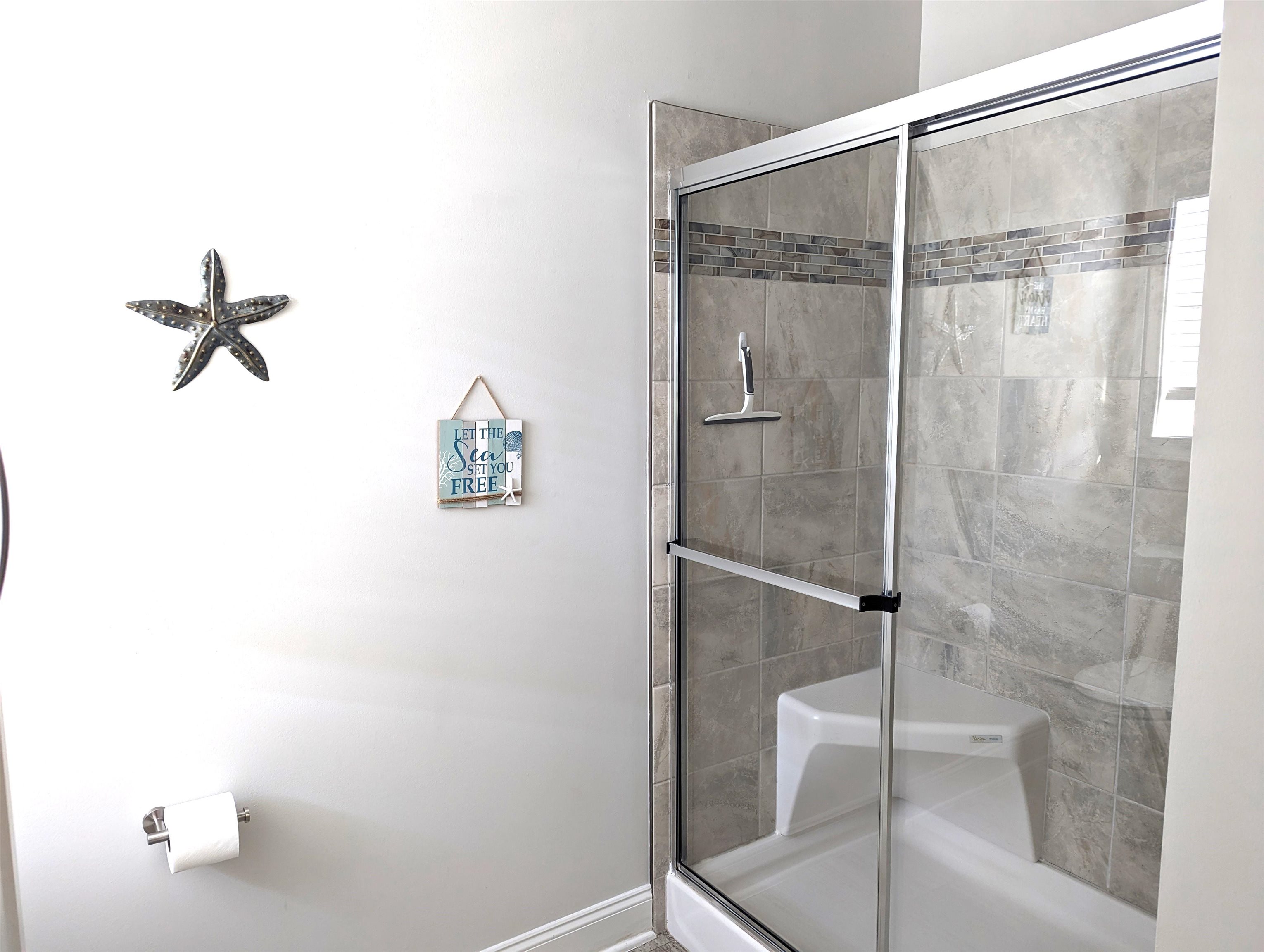 2058 S Shore Ocean View, NJ 08246 - Photo 16 of 27 a bathroom with a glass shower door