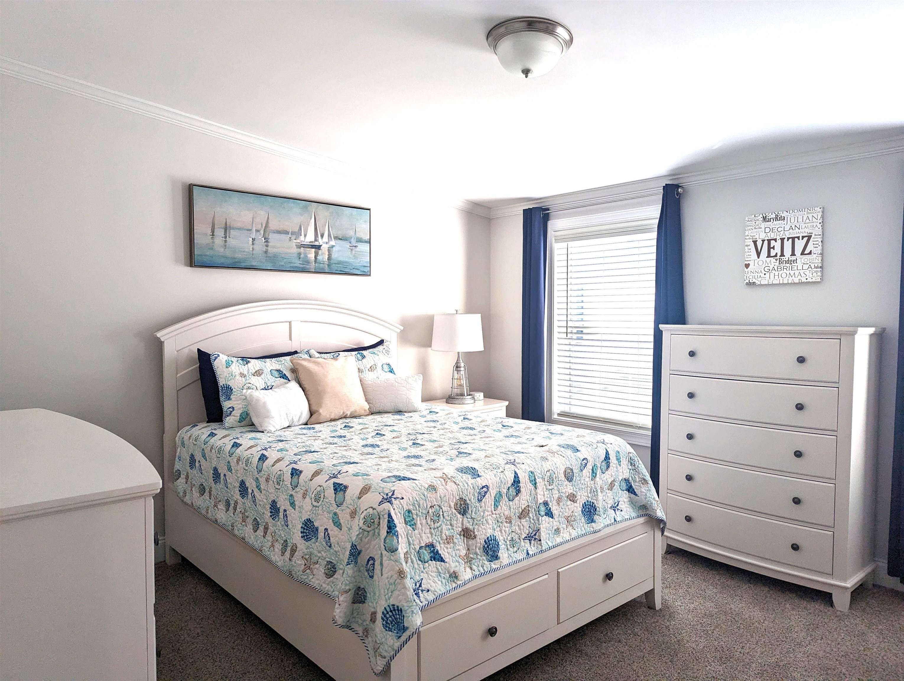 2058 S Shore Ocean View, NJ 08246 - Photo 18 of 27 a bedroom with a bed and a dresser
