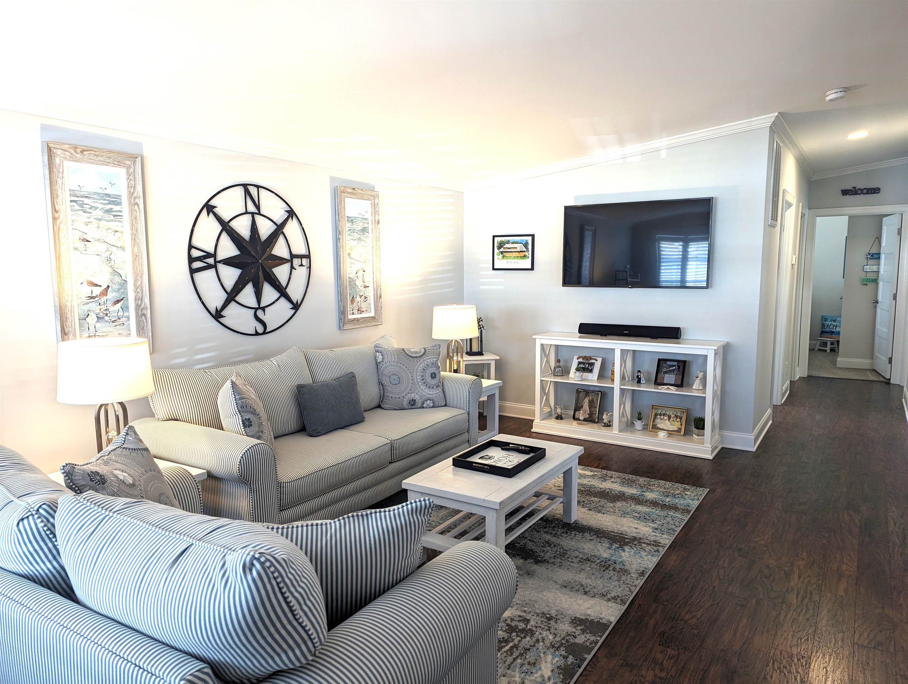 2058 S Shore Ocean View, NJ 08246 - Photo 3 of 27 a living room with furniture a flat screen tv and a fireplace