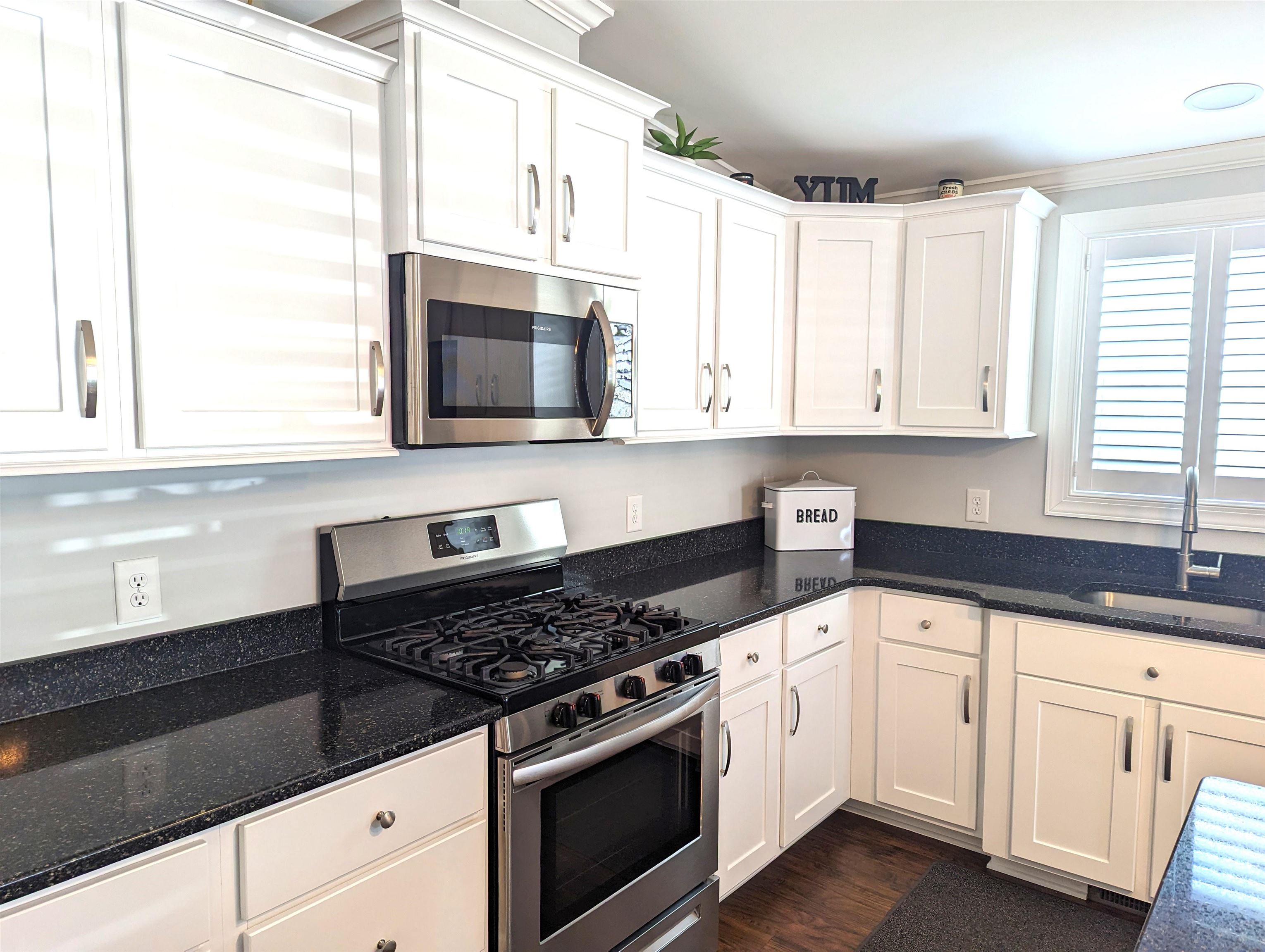 2058 S Shore Ocean View, NJ 08246 - Photo 5 of 27 a kitchen with granite countertop white cabinets and white appliances