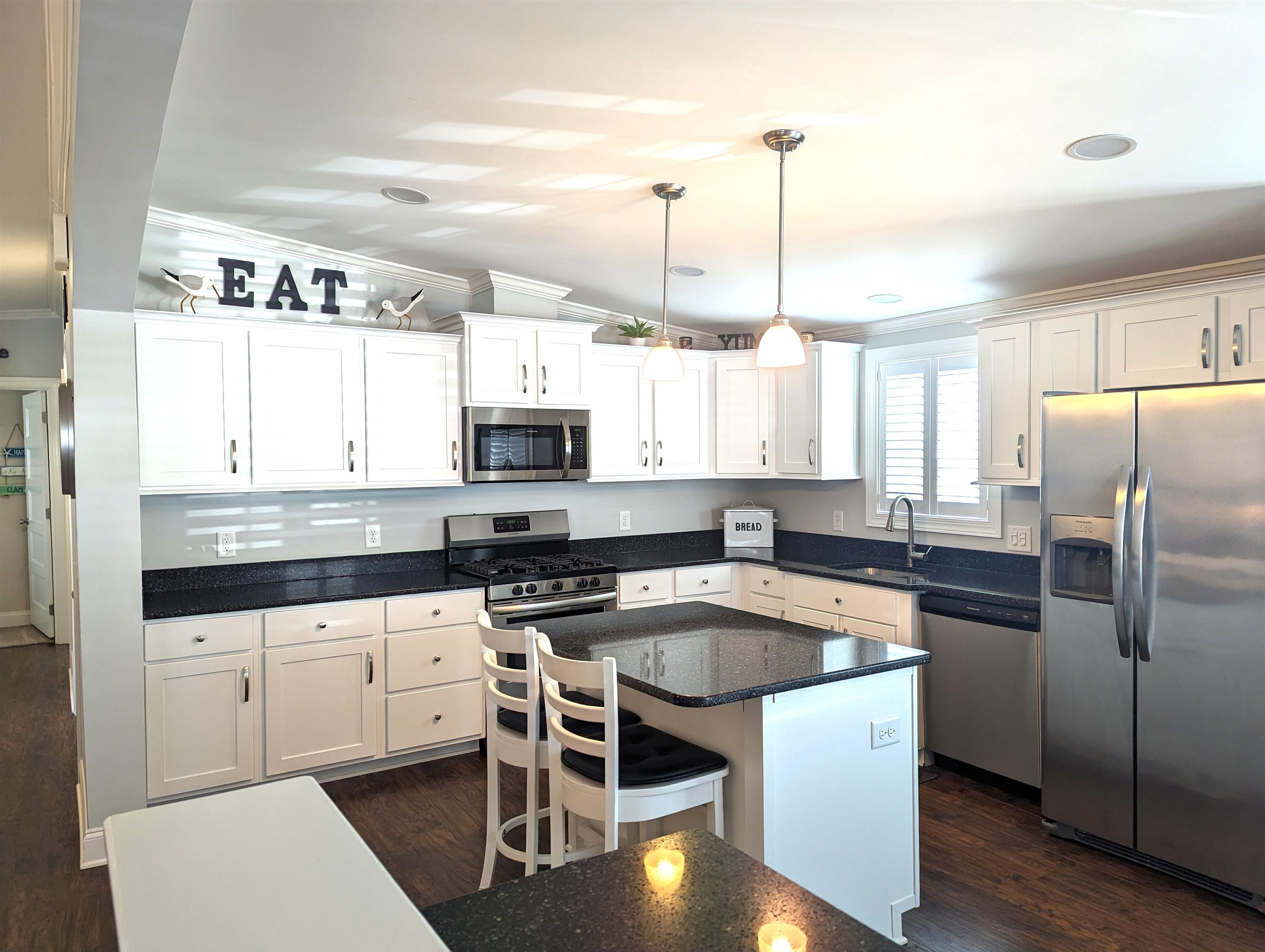 2058 S Shore Ocean View, NJ 08246 - Photo 6 of 27 a kitchen with stainless steel appliances granite countertop a sink a stove a microwave a counter top space and cabinets