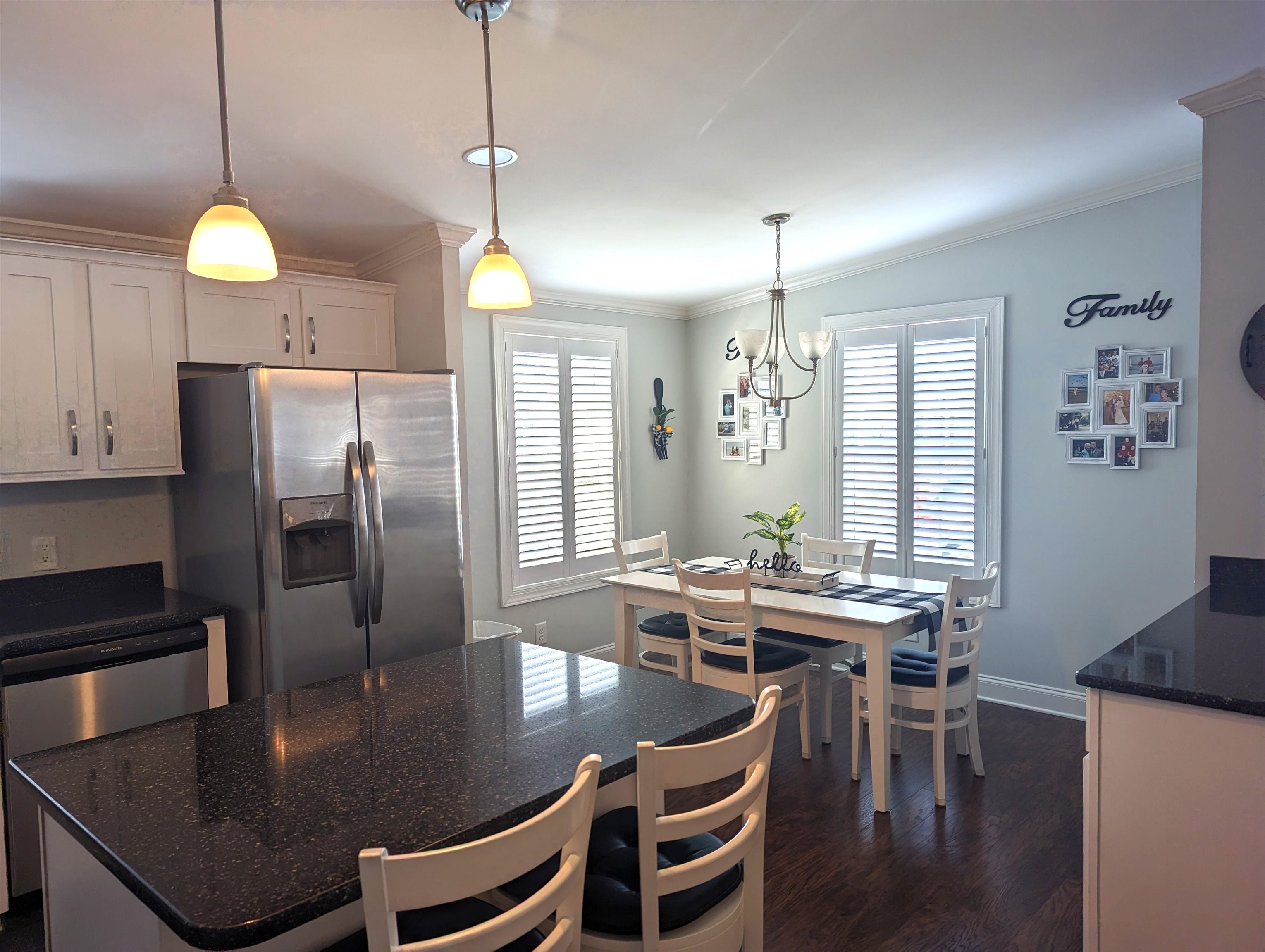 2058 S Shore Ocean View, NJ 08246 - Photo 8 of 27 a kitchen with kitchen island a dining table and chairs