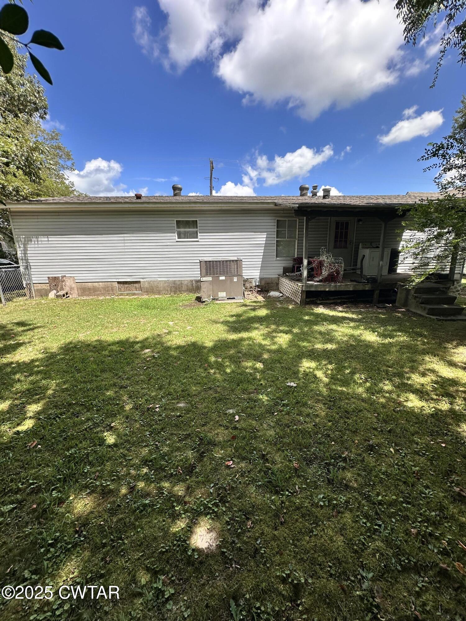 1730 Stallings Road Humboldt, TN 38343 - Photo 19 of 21 a view of a swimming pool with an outdoor seating and a yard