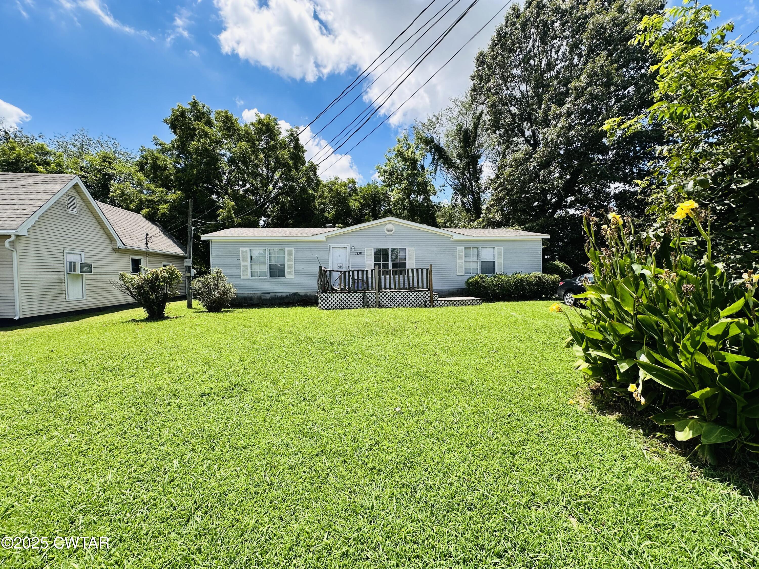 1730 Stallings Road Humboldt, TN 38343 - Photo 21 of 21 a view of a house with a yard