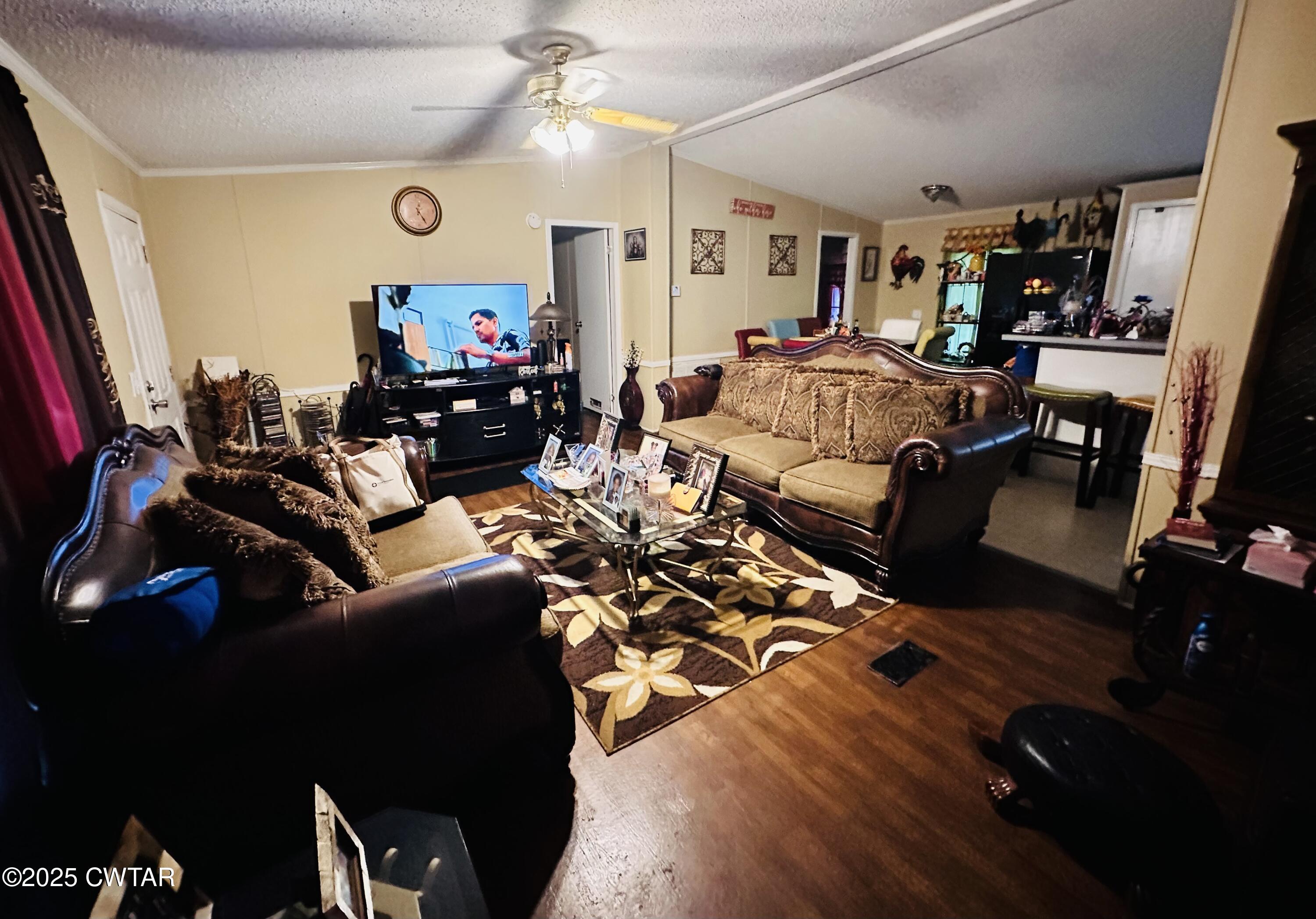 1730 Stallings Road Humboldt, TN 38343 - Photo 5 of 21 a living room with furniture and a flat screen tv