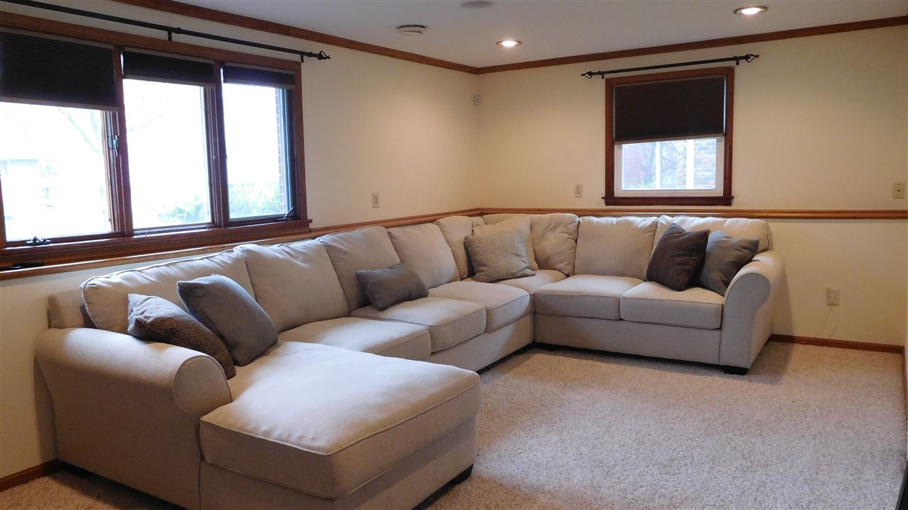 4874 Braewild Road Rockford, IL 61107 - Photo 18 of 23 a living room with furniture and a large window
