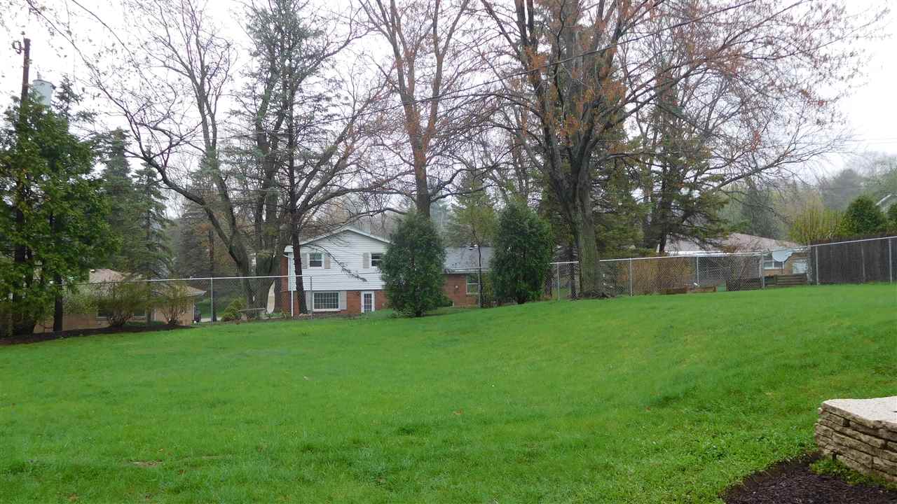 4874 Braewild Road Rockford, IL 61107 - Photo 23 of 23 a view of a garden with a house in the background