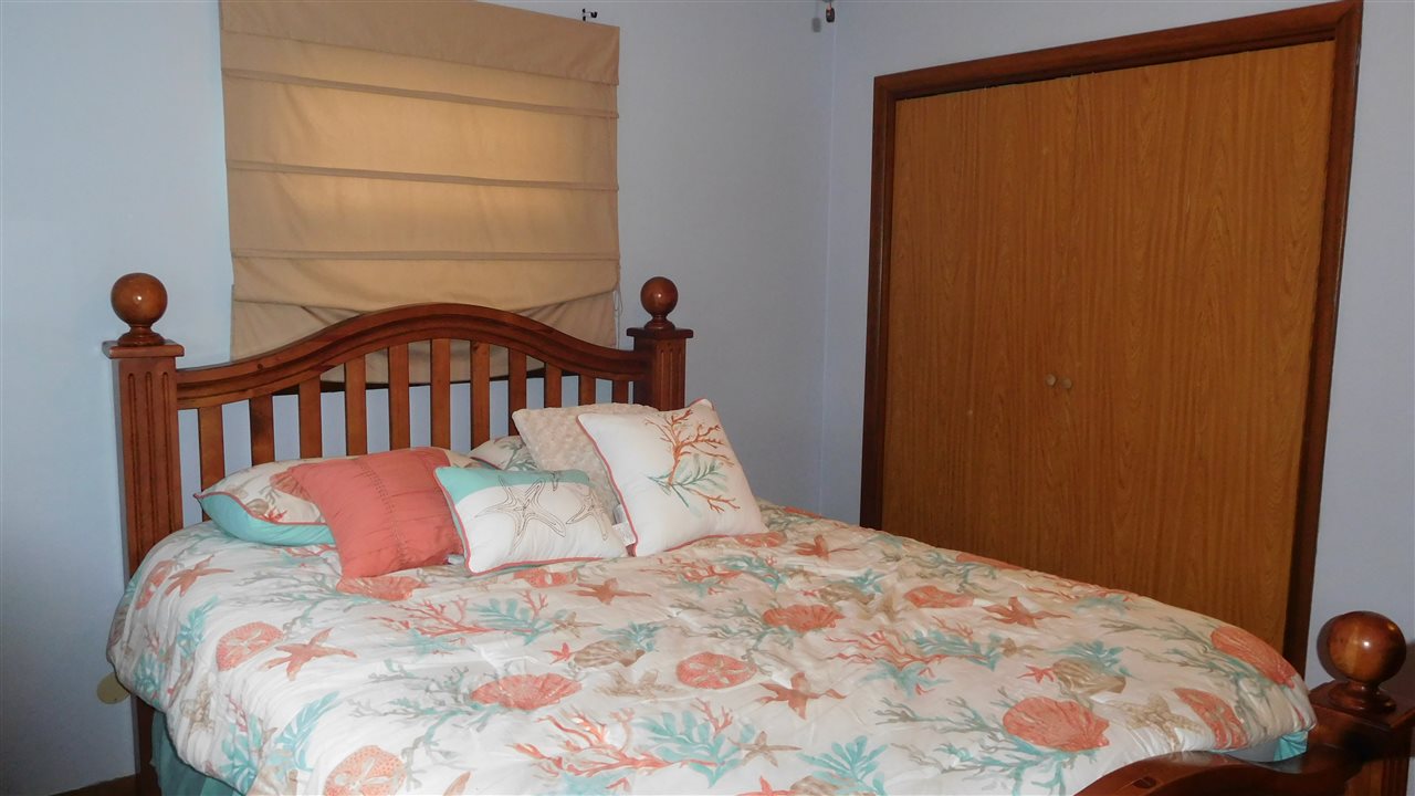 4874 Braewild Road Rockford, IL 61107 - Photo 10 of 23 a bedroom with a bed and a window