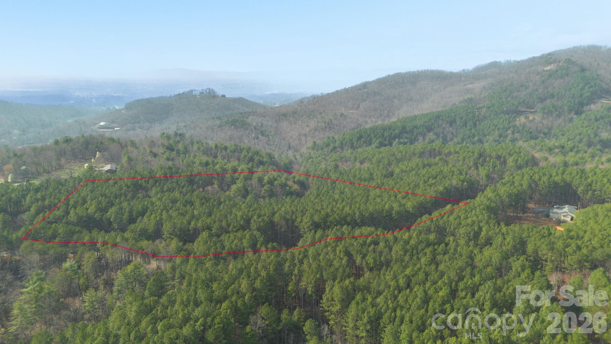 4196 South View Boulevard Morganton, NC 28655 - Photo 7 of 11 a view of a lush green hillside and a mountain