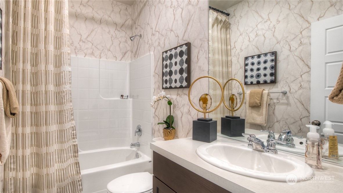 1017 Panoramic Loop, Unit 95 Bremerton, WA 98312 - Photo 12 of 14 a bathroom with a sink and a mirror