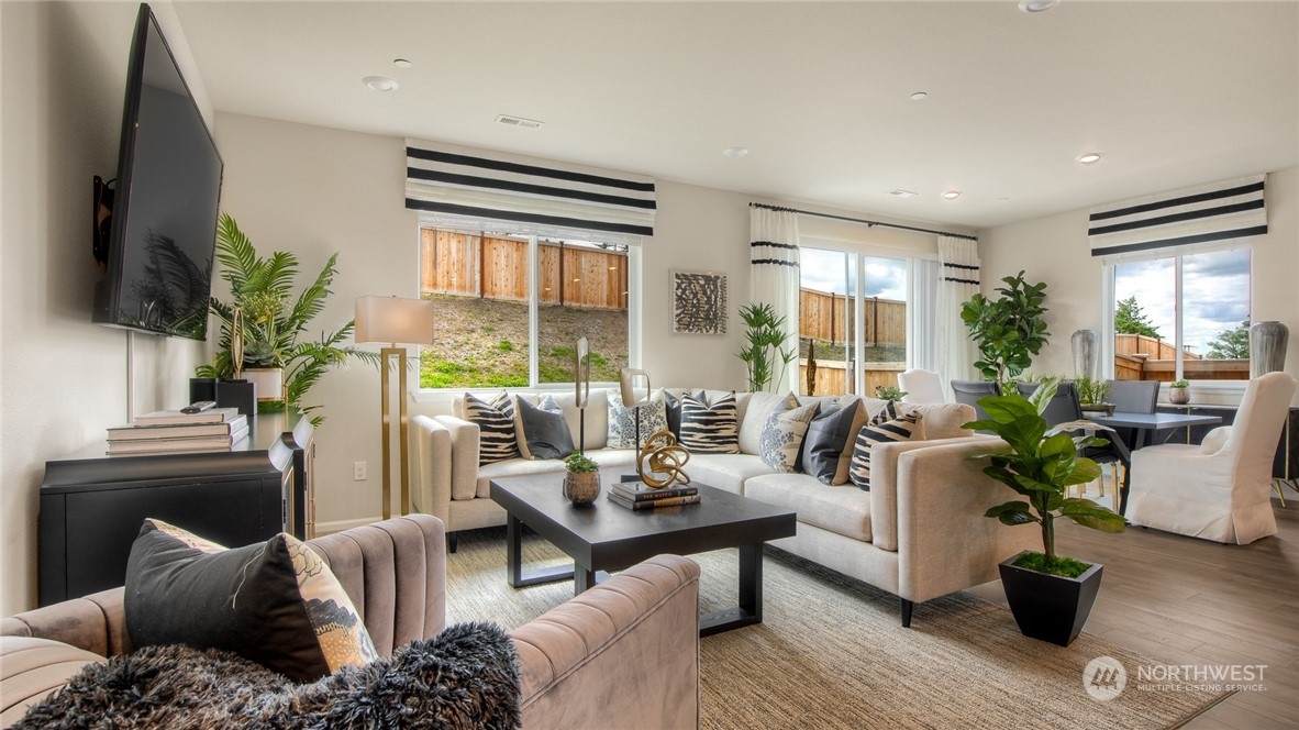 1017 Panoramic Loop, Unit 95 Bremerton, WA 98312 - Photo 3 of 14 a living room with furniture potted plant and a large window