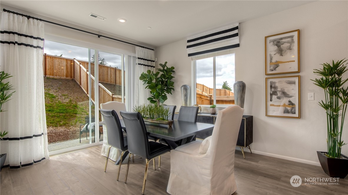1017 Panoramic Loop, Unit 95 Bremerton, WA 98312 - Photo 5 of 14 a view of a dining room with furniture window and outside view