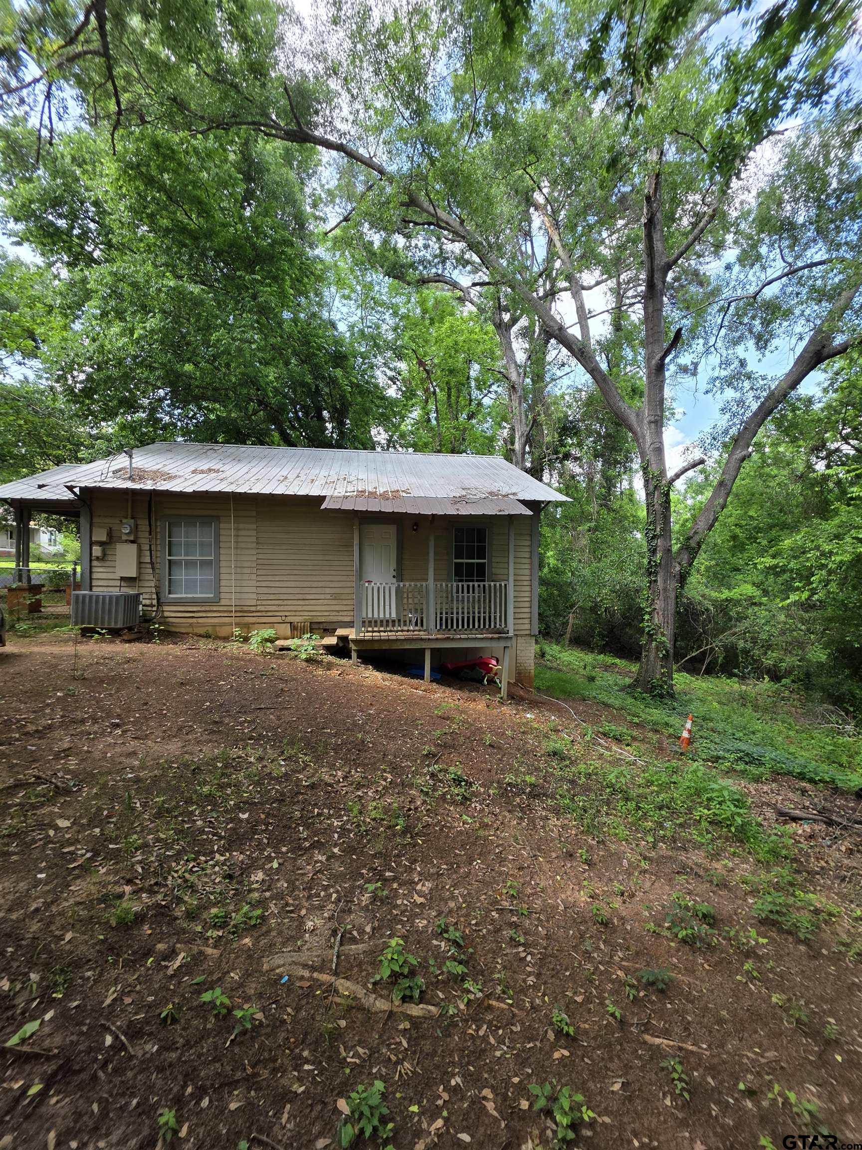 316 North Hospital Street Rusk, TX 75785 - Photo 5 of 21 a front view of a house with a yard