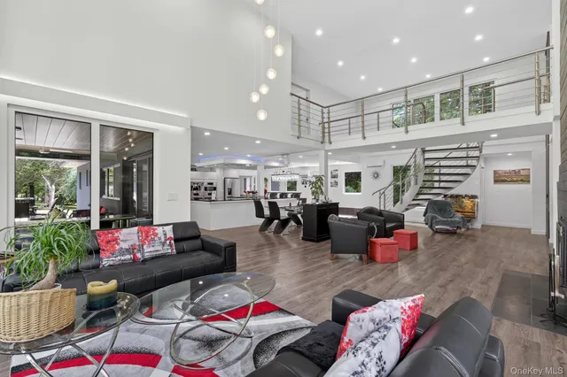 a living room with furniture a large window