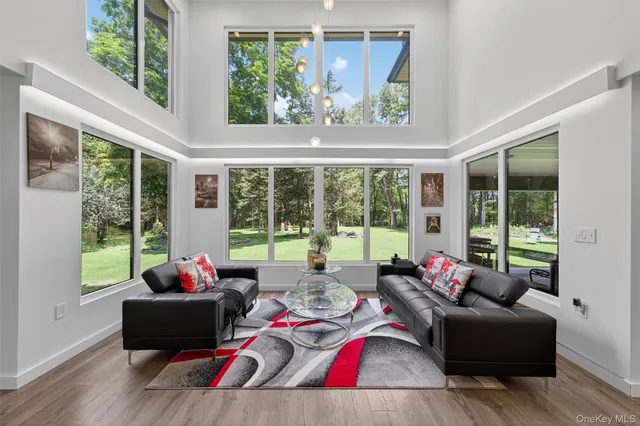 a view of an entryway with wooden floor