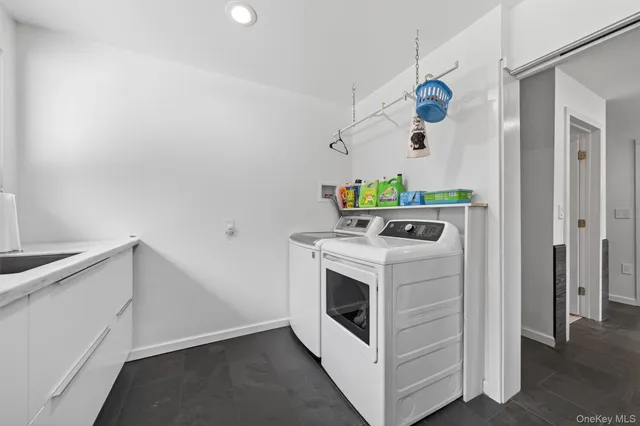 a bathroom with a bathtub and a sink