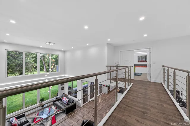 a view of a workspace with furniture and a workspace