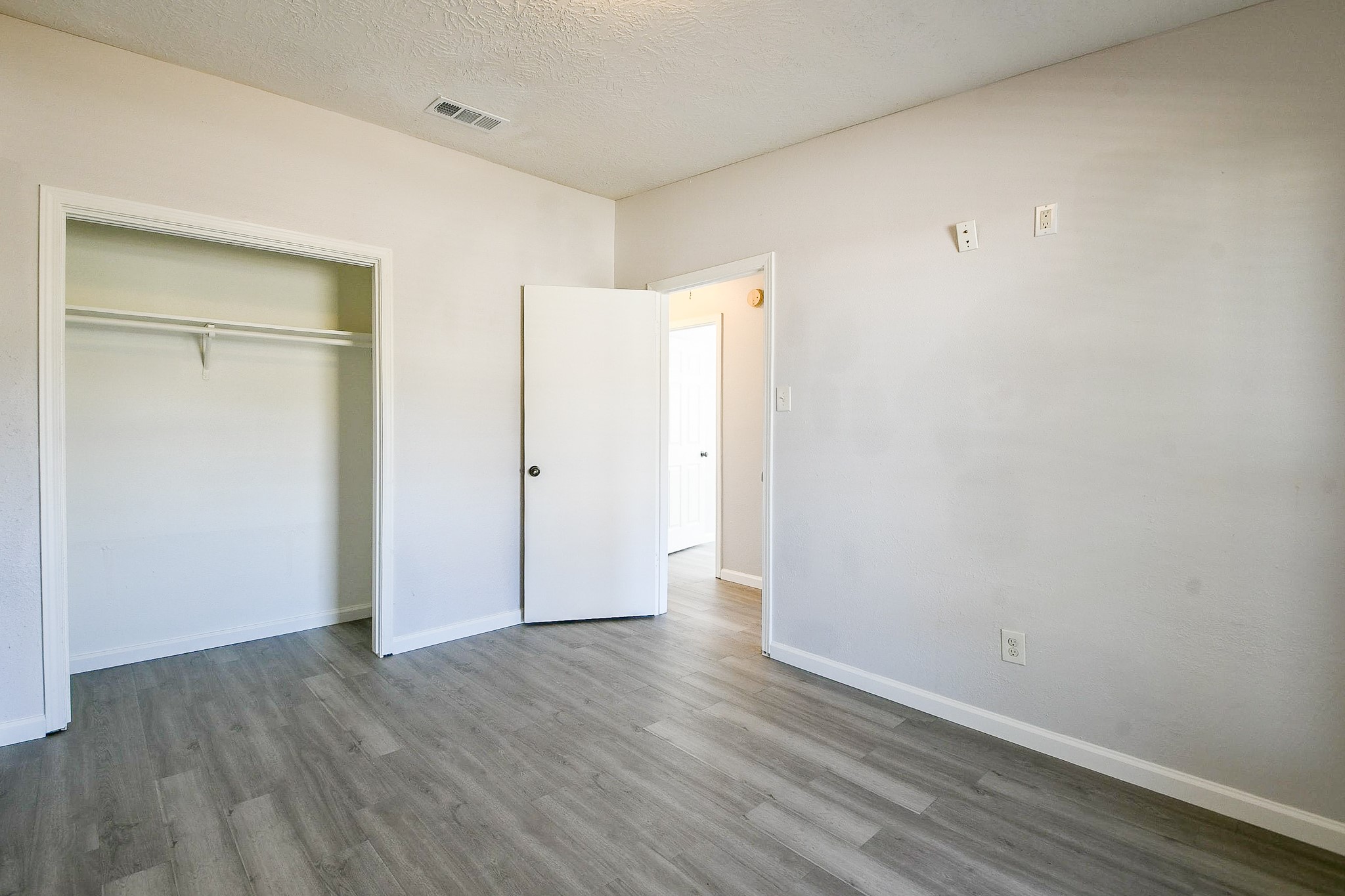 4719 Brownfields Drive Houston, TX 77066 - Photo 17 of 20 an empty room with wooden floor