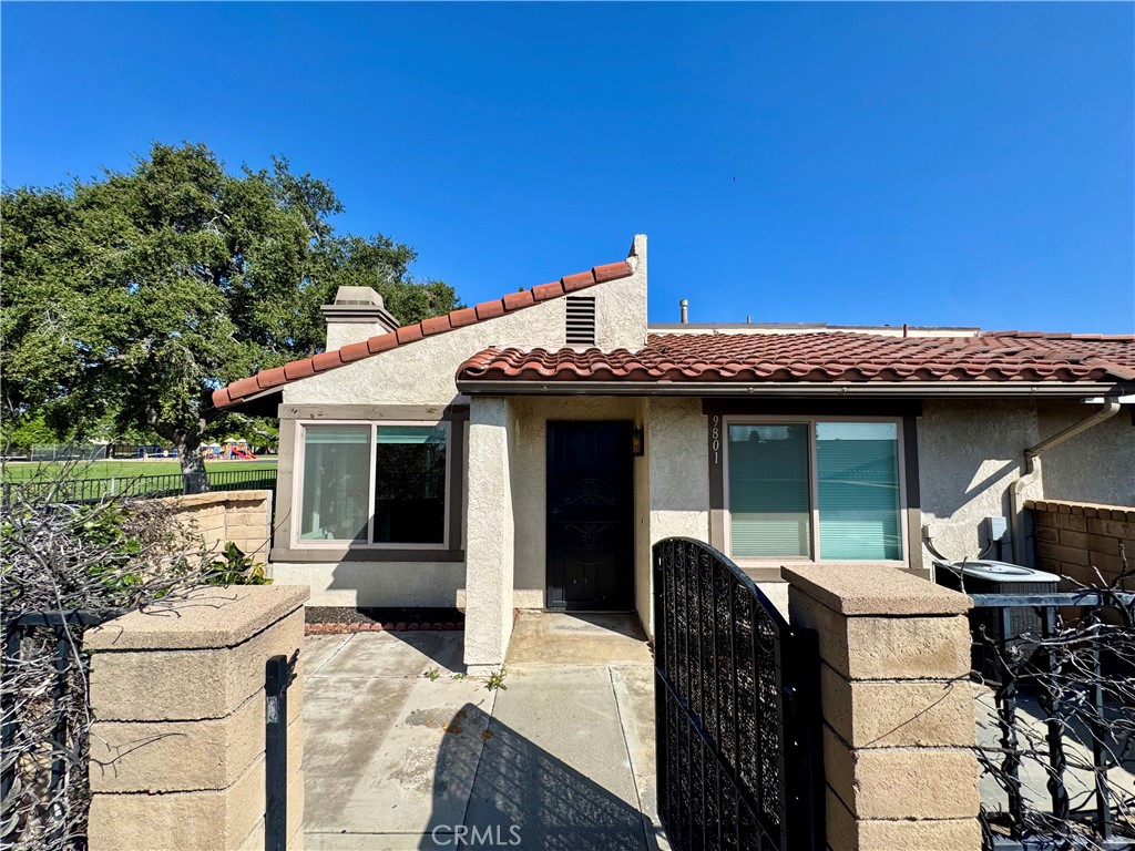 a view of a patio with table and chairs and potted plants