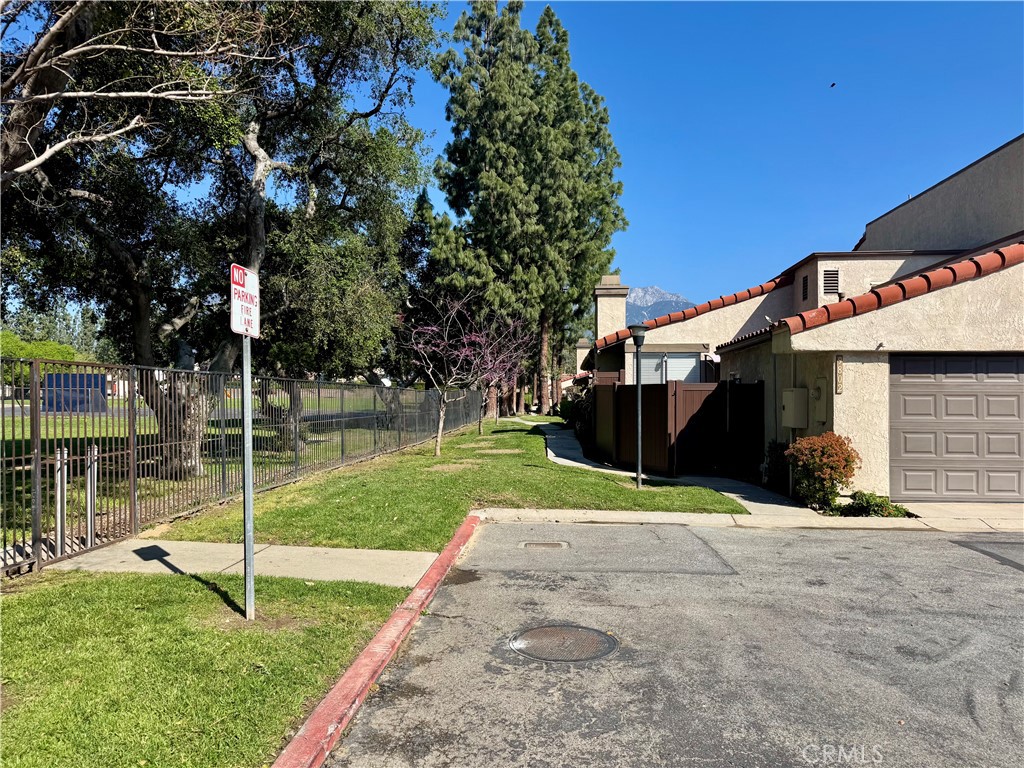 9801 Allesandro Court Rancho Cucamonga, CA 91730 - Photo 20 of 21 a view of a house with a yard