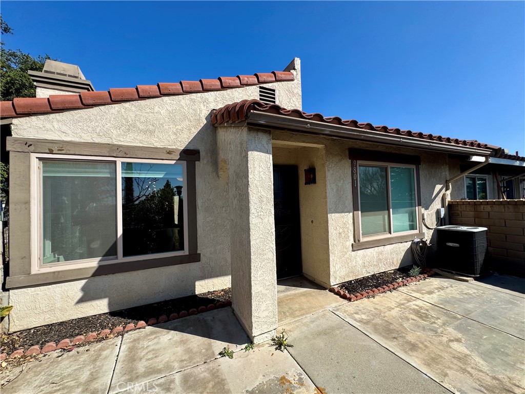 9801 Allesandro Court Rancho Cucamonga, CA 91730 - Photo 2 of 21 a view of a house with a door and porch