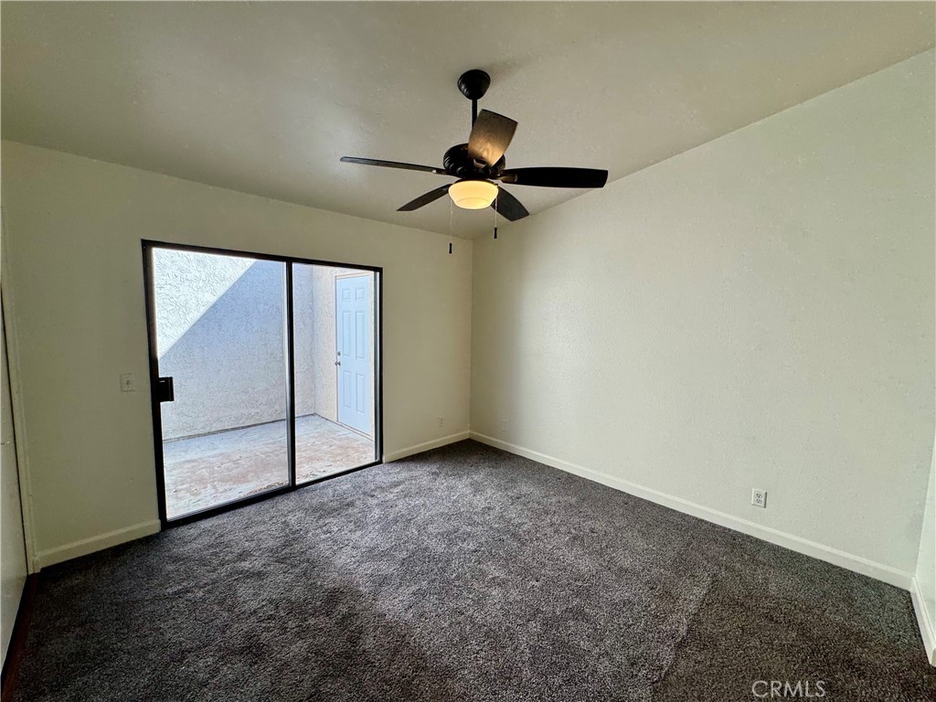 9801 Allesandro Court Rancho Cucamonga, CA 91730 - Photo 9 of 21 a view of empty room with ceiling fan
