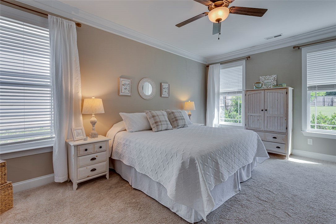 203 Streams Way Anderson, SC 29625 - Photo 8 of 47 This peaceful bedroom provides a comfortable retreat with ample natural light.