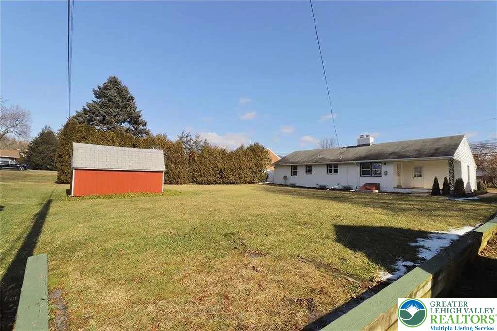 3111 Hecktown Road Bethlehem, PA 18020 - Photo 24 of 24 a view of a house with pool and trees in the background
