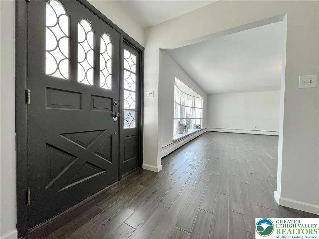 3111 Hecktown Road Bethlehem, PA 18020 - Photo 6 of 24 an empty room with wooden floor and windows