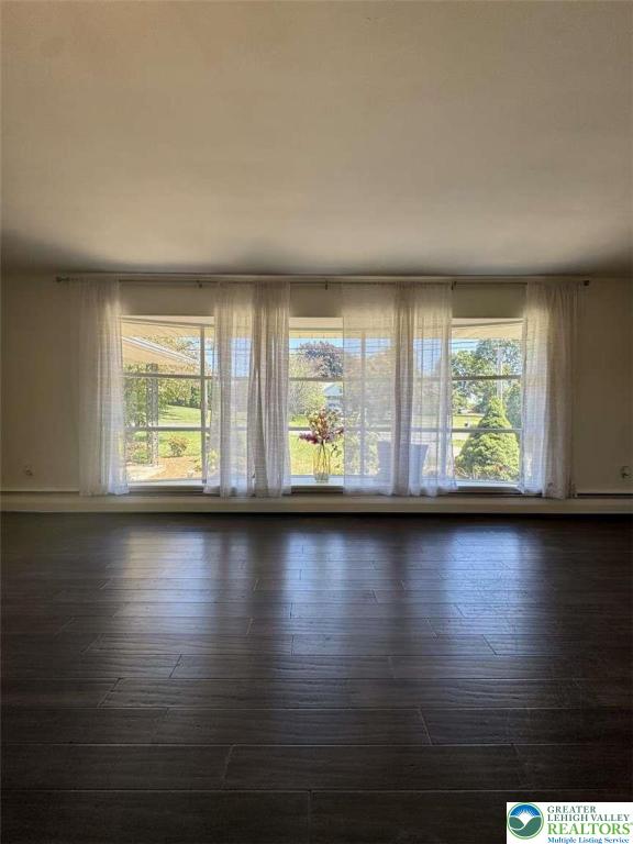 3111 Hecktown Road Bethlehem, PA 18020 - Photo 7 of 24 an empty room with wooden floor and windows