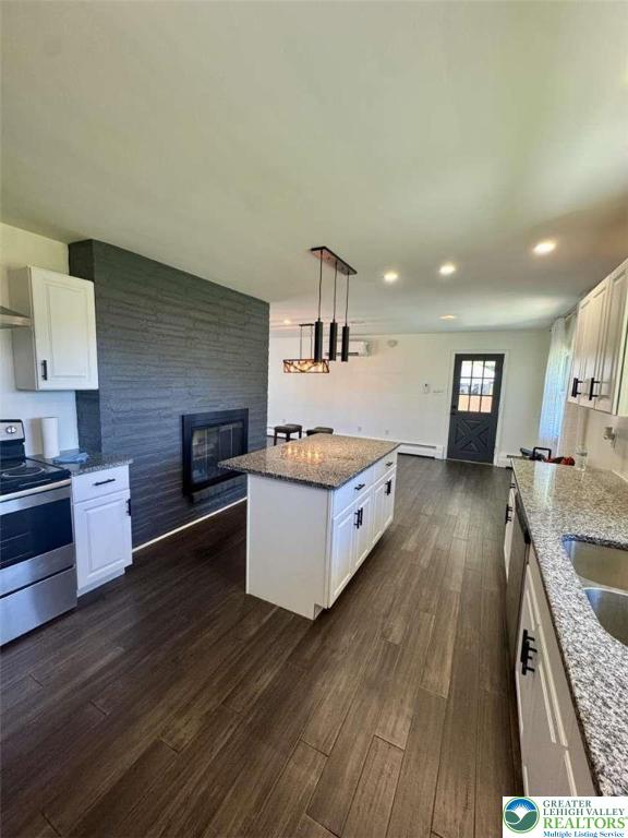 3111 Hecktown Road Bethlehem, PA 18020 - Photo 10 of 24 a large kitchen with stainless steel appliances granite countertop a large counter top a stove and a wooden floors