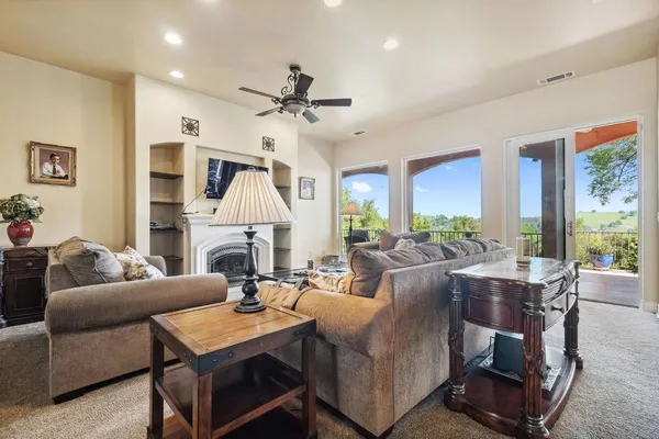 a view of a dining room with furniture and a rug