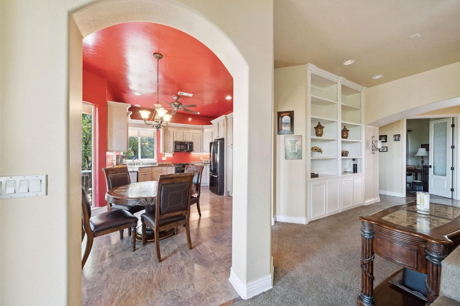 125 Raylan Drive Sutter Creek, CA 95685 - Photo 22 of 79 a view of a dining room with furniture and a rug