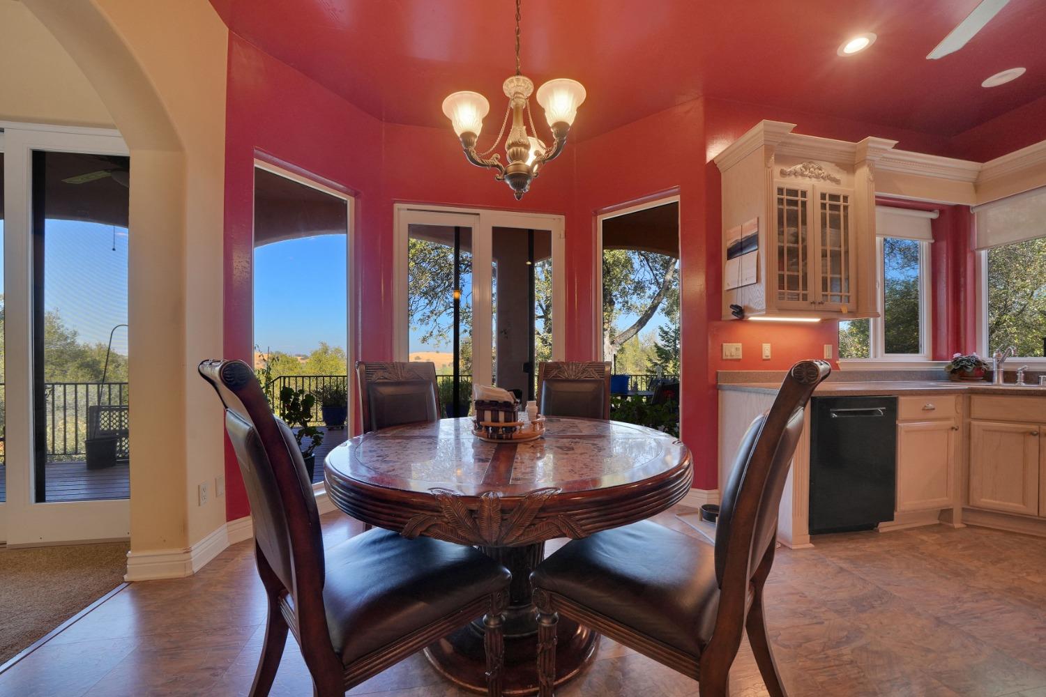 125 Raylan Drive Sutter Creek, CA 95685 - Photo 23 of 79 a view of a dining room with furniture and wooden floor