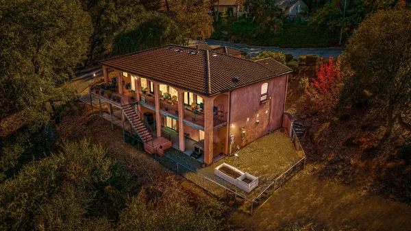 aerial view of a house with a yard