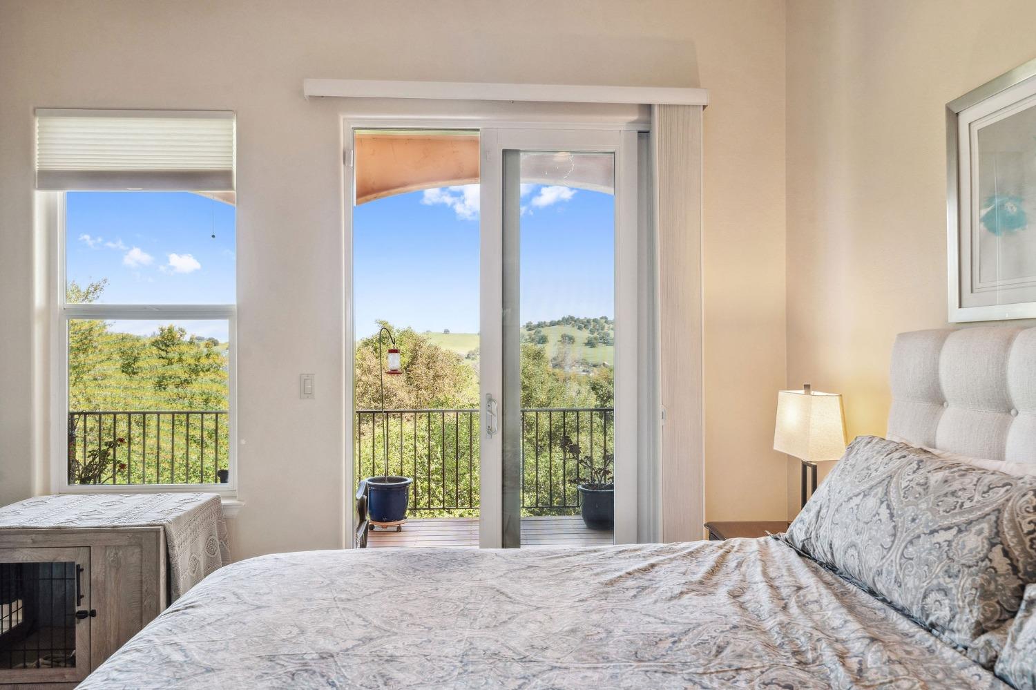 125 Raylan Drive Sutter Creek, CA 95685 - Photo 31 of 79 a bedroom with a bed and a window