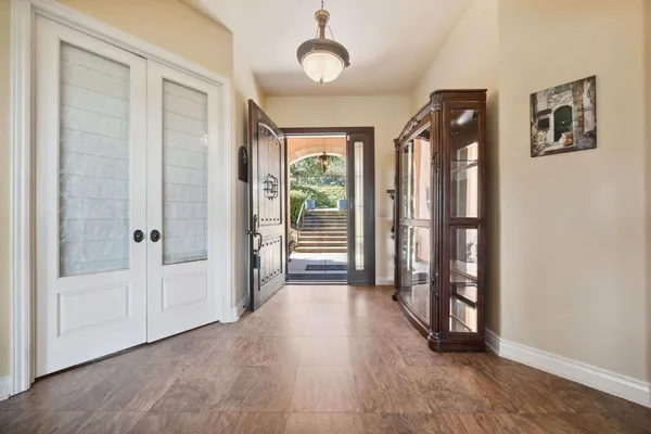 a living room with lots of furniture and gym equipment